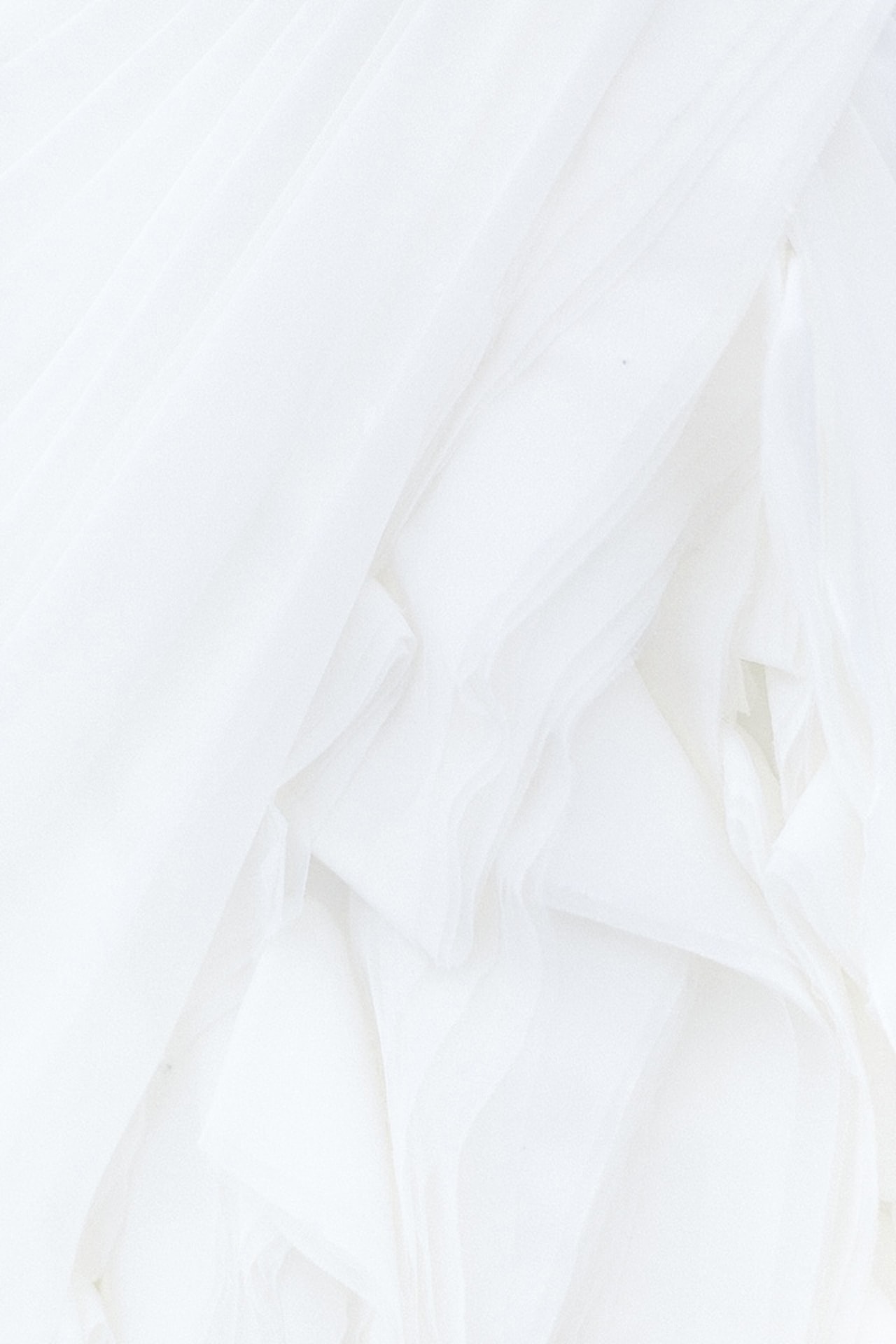 Layered white fabric draped elegantly.