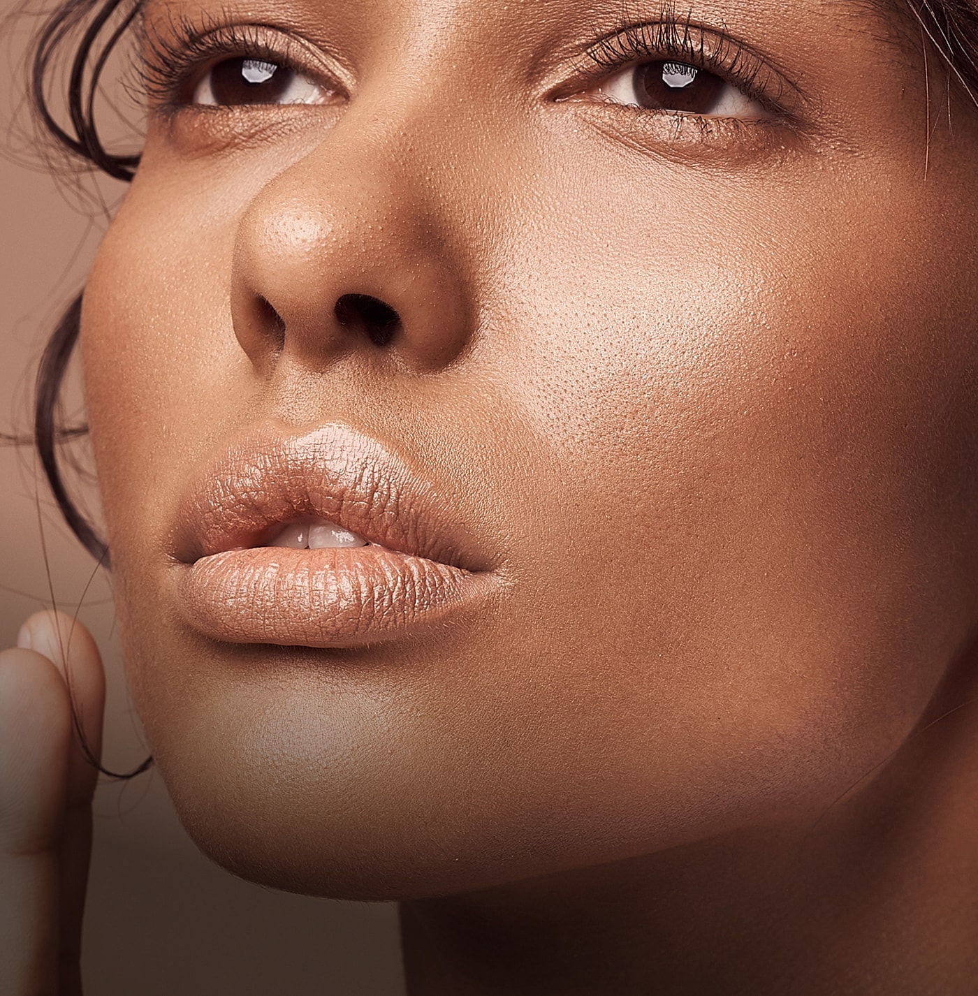 Close-up of a woman's face with natural makeup.