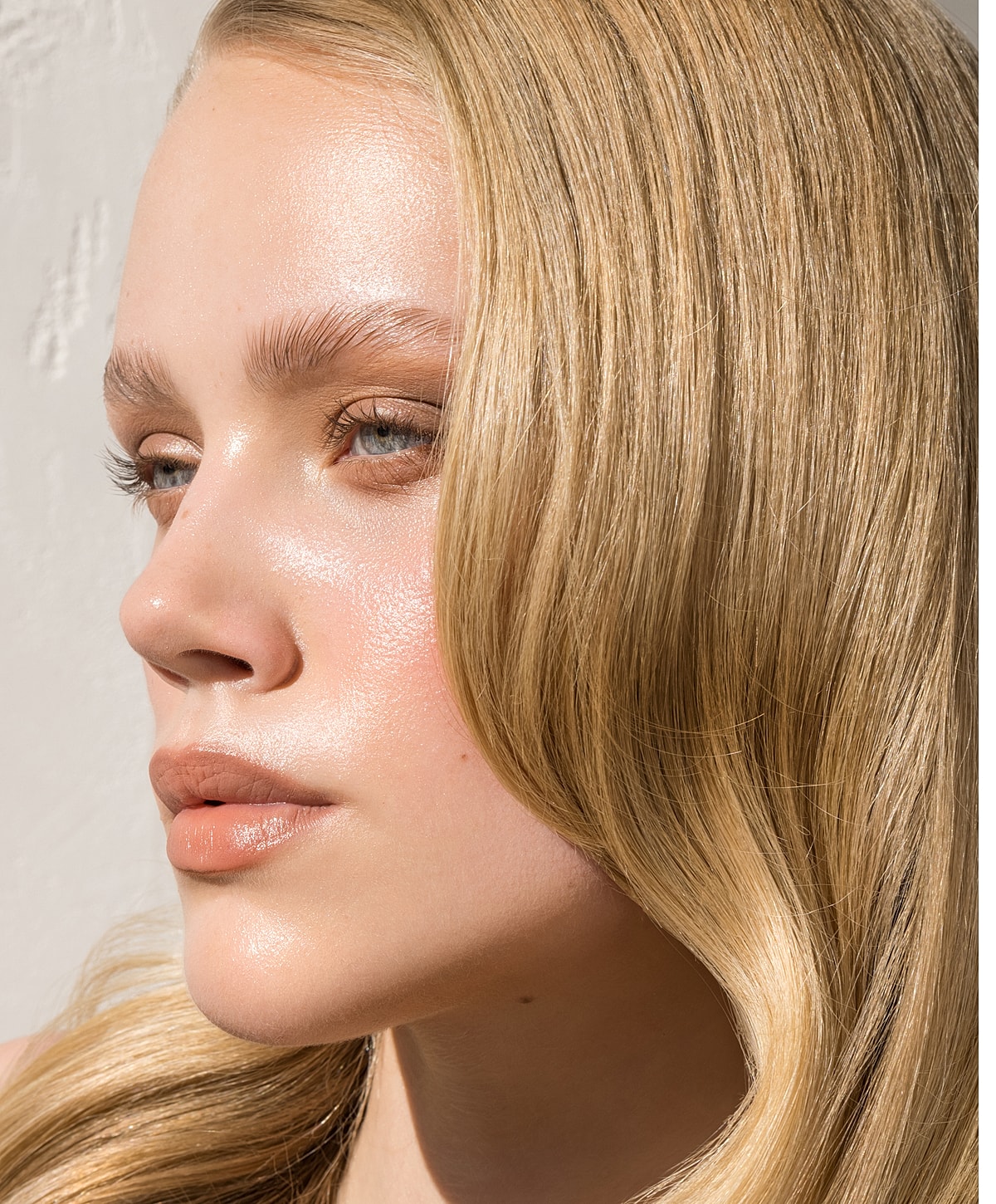 Close-up of a blonde woman with beautiful skin.