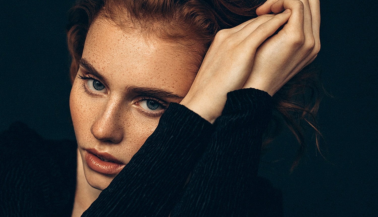 Profile of a woman with elegant pose.