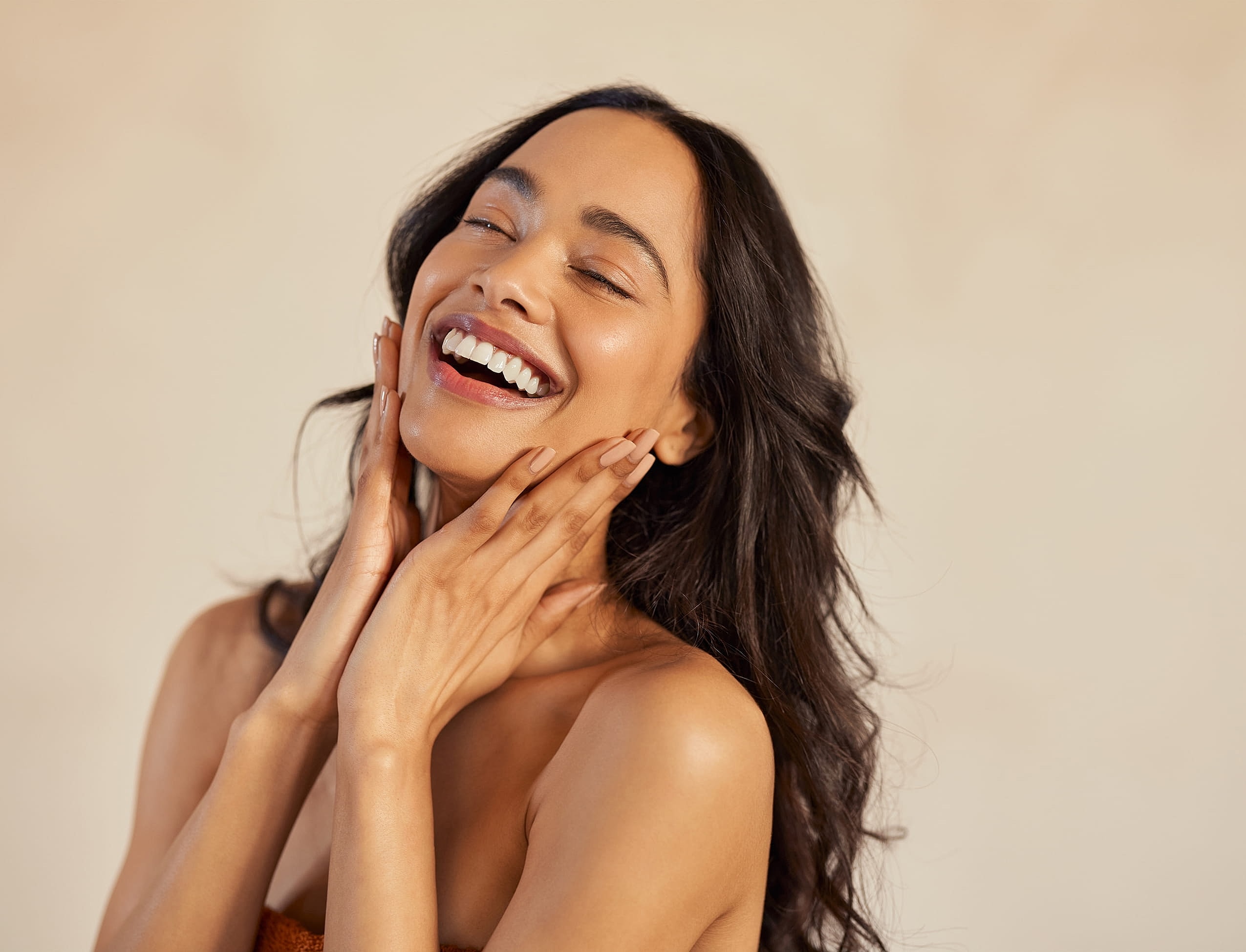 Three women posing in a skincare clinic.