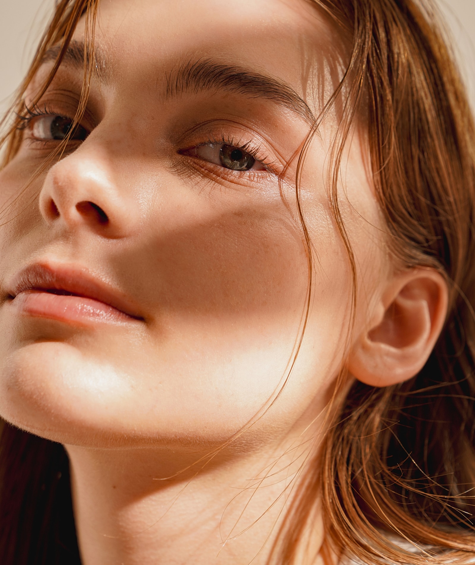 Close-up of a woman’s face in natural light.