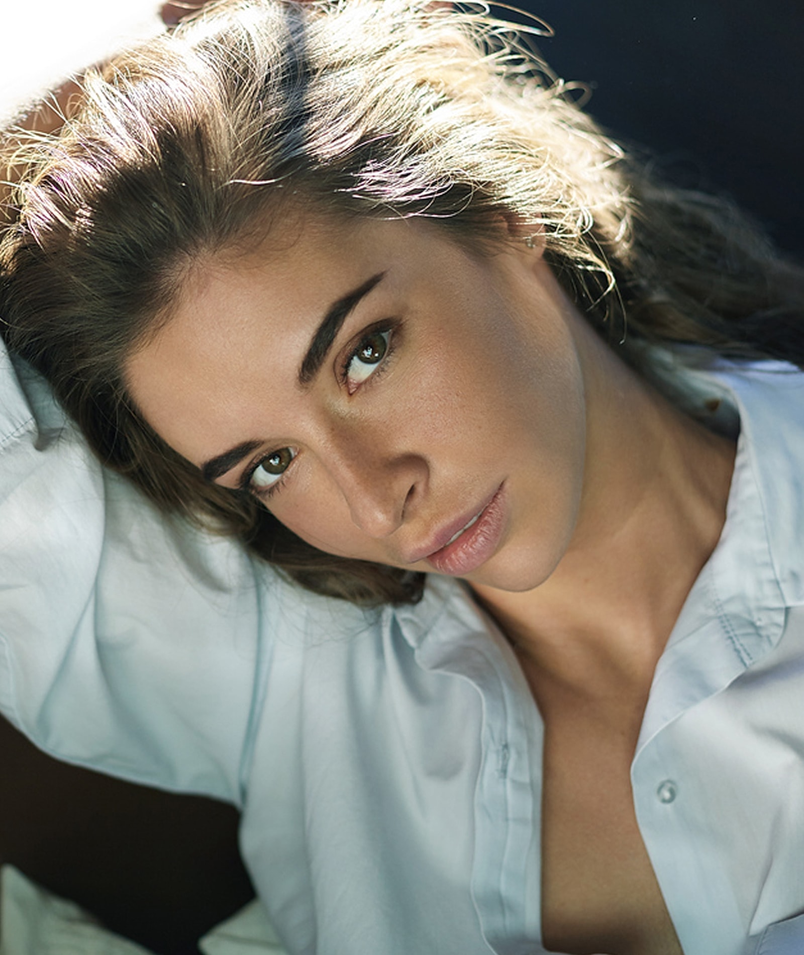 Woman with natural beauty and soft expression.