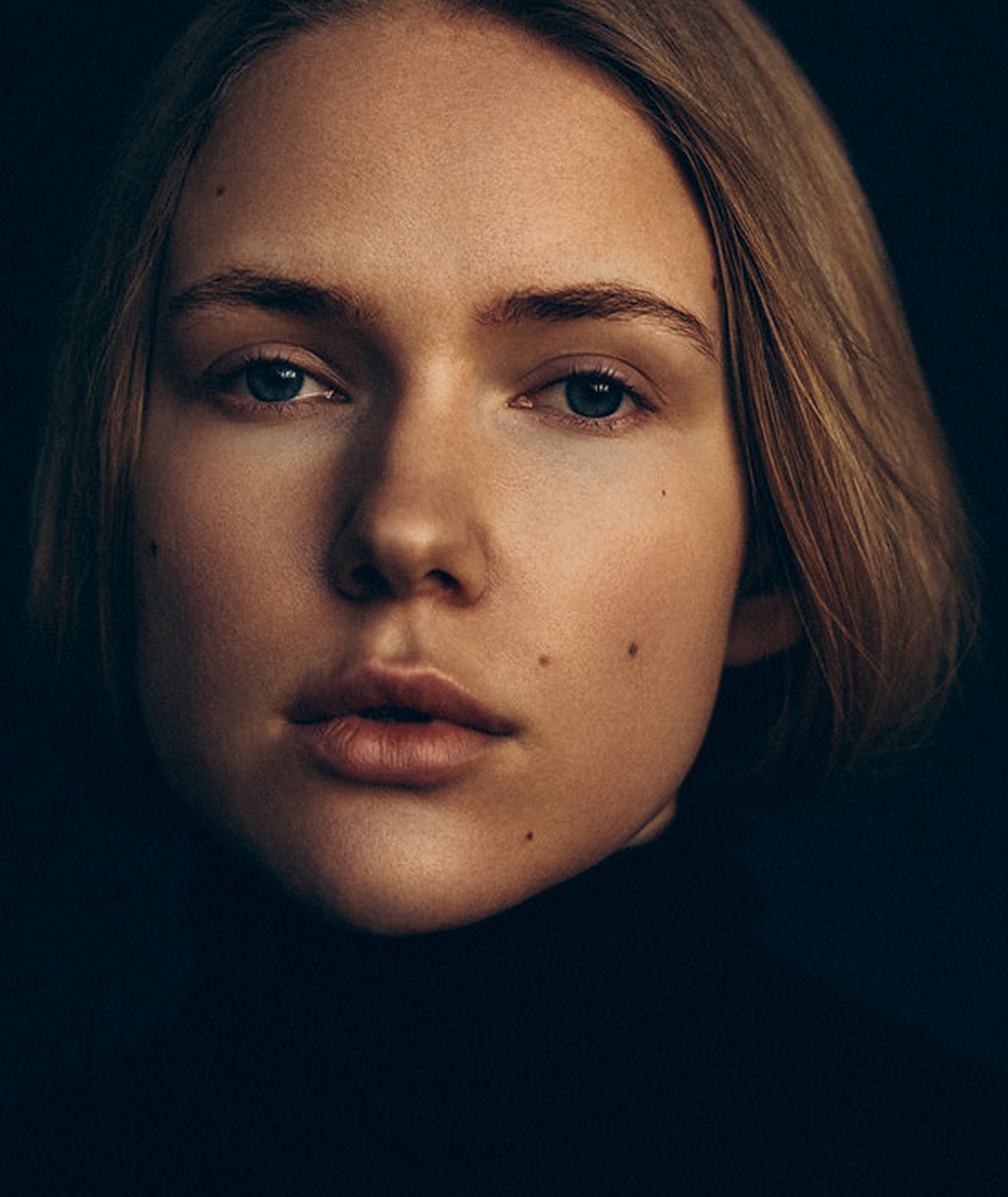 Portrait of a person with a serious expression.